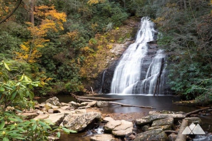 a waterfall surrounded by trees