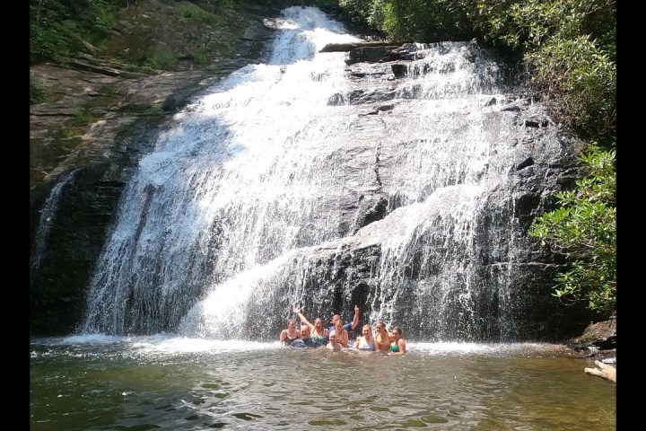 a large waterfall over a body of water