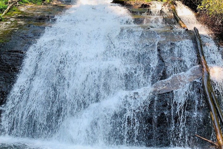 a man riding on the back of a waterfall