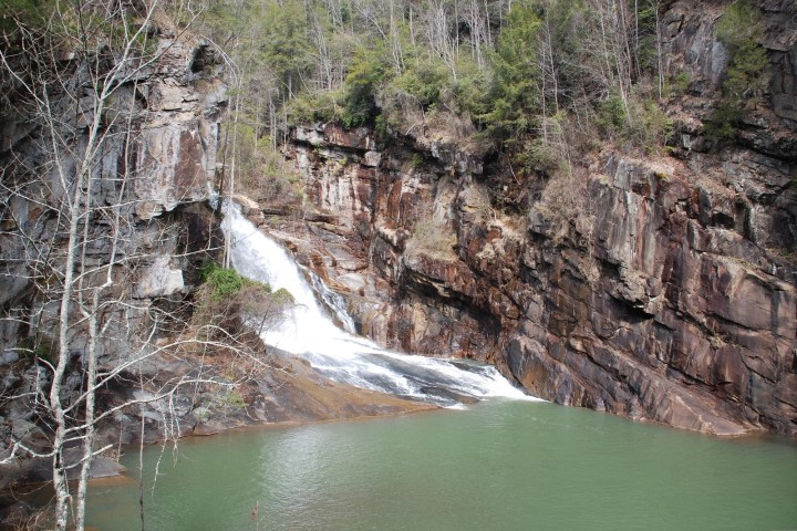 a large waterfall over a river