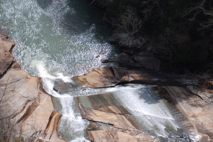 a large waterfall over some water